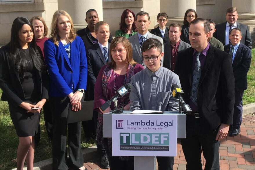 Connor Thonen-Fleck addresses reporters while his parents stand by his side, March 11, 2019, in Durham, N.C.