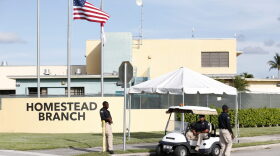 Security guards stand outside a former Job Corps site that now houses child immigrants, Monday, June 18, 2018, in Homestead, Fla. It is not known if the children crossed the border as unaccompanied minors or were separated from family members. (AP Photo/Wilfredo Lee)