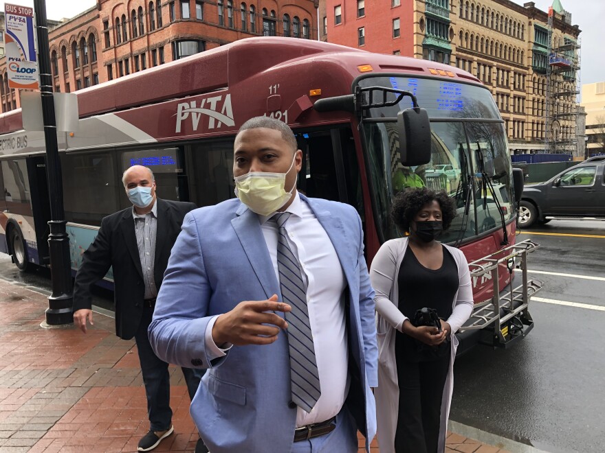 Springfield, Massachusetts, City Councilors Victor Davila, Justin Hurst and Tracye Whitfield exiting a PVTA bus after speaking with riders about their proposal for eliminating fares.