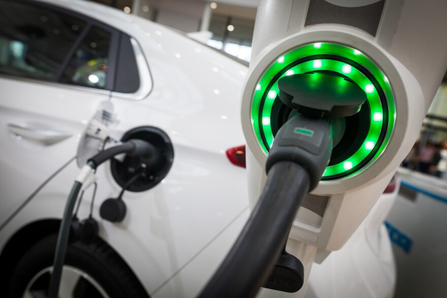 Close up image of the power socket of an electric car, charging.