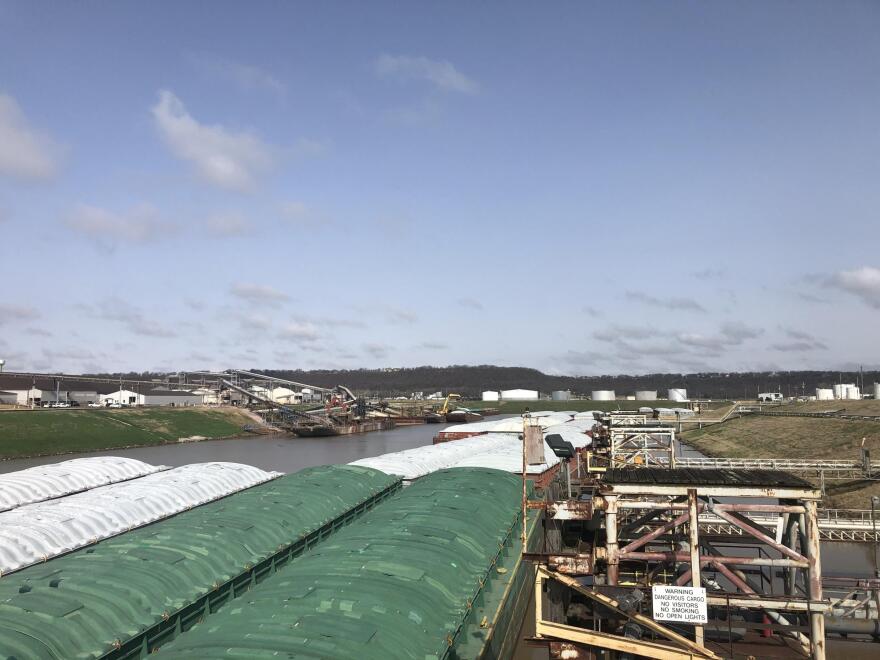 Barges float on the McClellan-Kerr Navigation system at the Port of Catoosa in Tulsa, OK. Barges hold 15,000 tons of soybeans, grain or fertilizer. Because of the lower costs and connection to the coast, farmers rely on the system. 