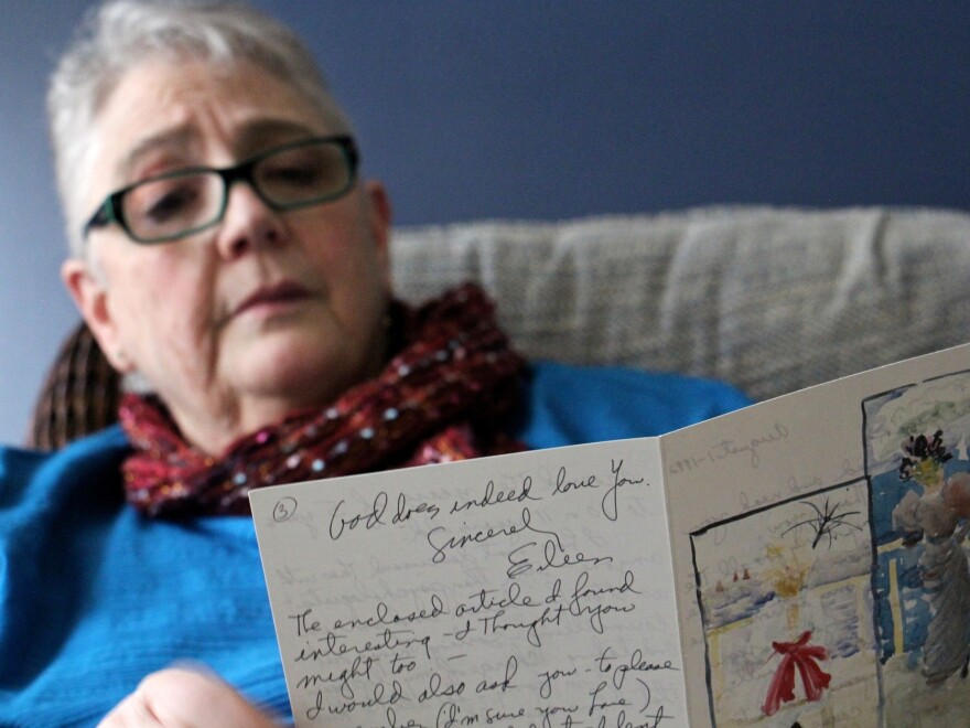 Patricia Cahill reads a card sent to her in 1992 by the nun who sexually abused her for years.