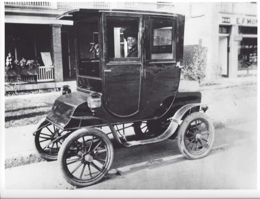 This photos shows Madam Walker at the wheel of her Waverly Electric.