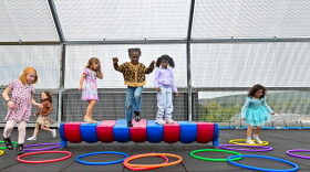 Kindergarten students in the St. Clair Area School District play on the rooftop playground during recess.
