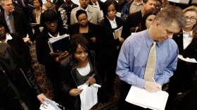 Job-seekers attend a job fair in Livonia, Mich., on Wednesday.