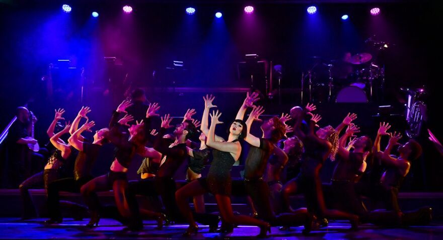 Taylor Lane as Velma Kelly leads the troupe in a spirited rendition of "All That Jazz."