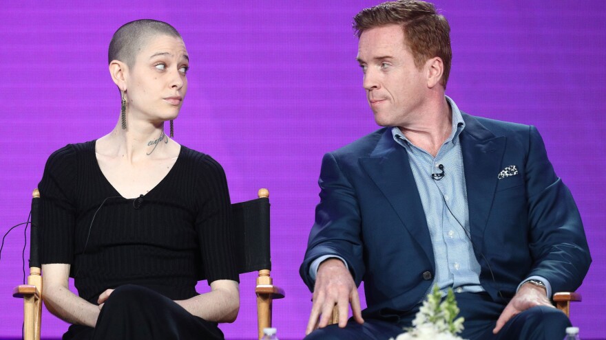 Actors Asia Kate Dillon, left, and Damian Lewis of the television show 'Billions' speak during the CBS/Showtime portion of the 2018 Winter Television Critics Association Press Tour in Pasadena, Calif.
