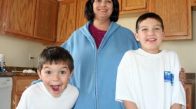 Carrie Cook and her two young sons escaped their Joplin, Mo., apartment just before a tornado obliterated it and most everything inside in May. Now, Cook's small house is one of 10 that Habitat for Humanity is putting up in Joplin this month.