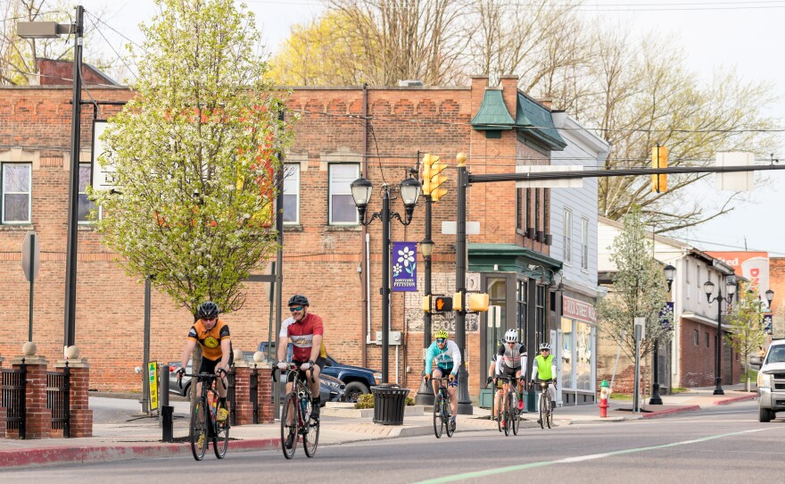 Cyclists ride through downtown Pittston during the 2022 Lu Lacka Wyco Hundo Bike Ride.