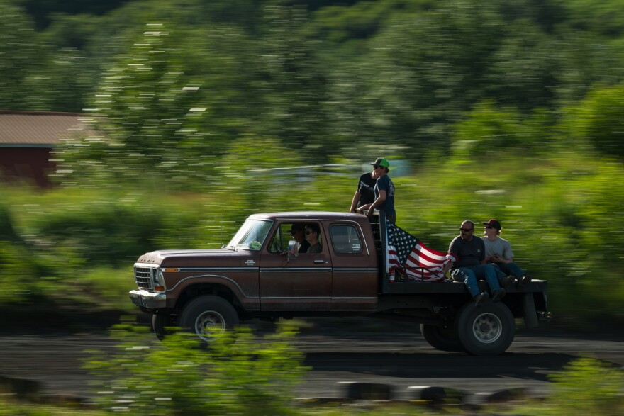 A track safety crew drives to help a stock car that can't make it off the track during a race on July 11, 2026.