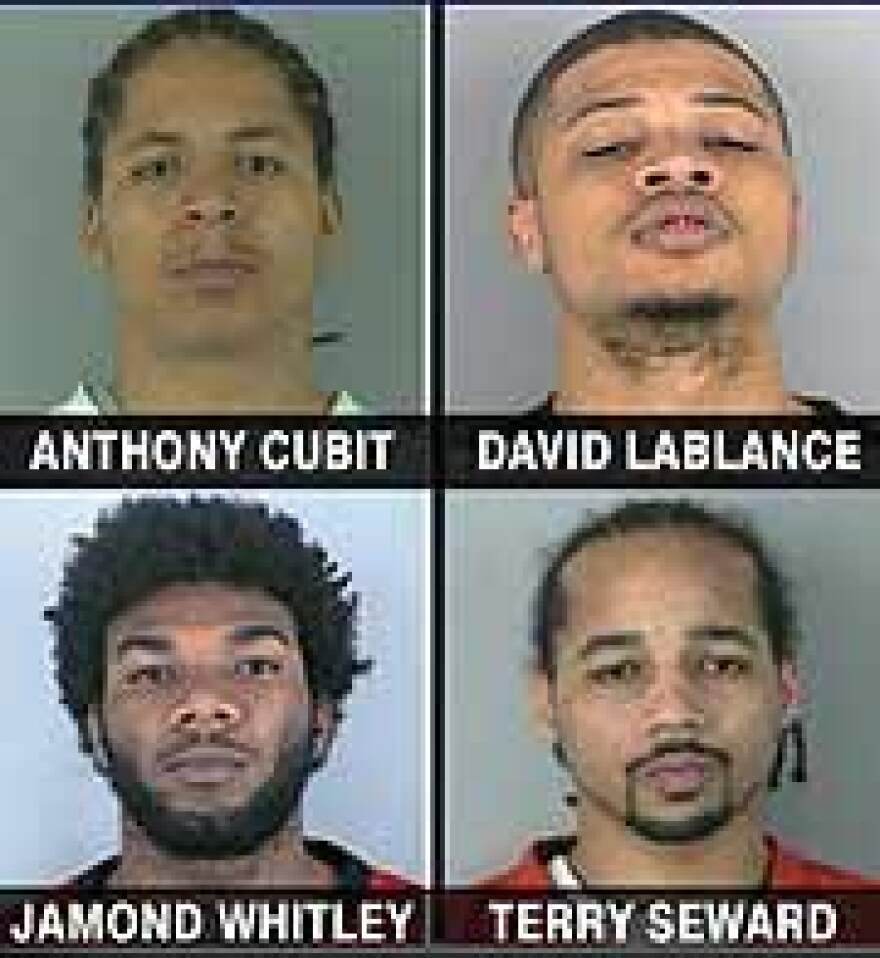 Police are asking for tips on the whereabouts of four other suspected gang members.