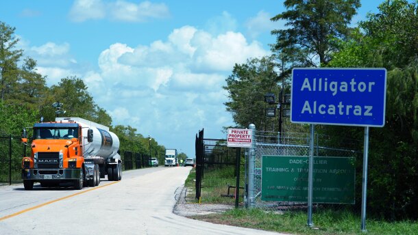 FILE - Trucks come and go from the "Alligator Alcatraz" immigration detention center in the Florida Everglades, Thursday, Aug. 28, 2025, in Collier County, Fla. (AP Photo/Rebecca Blackwell, File)