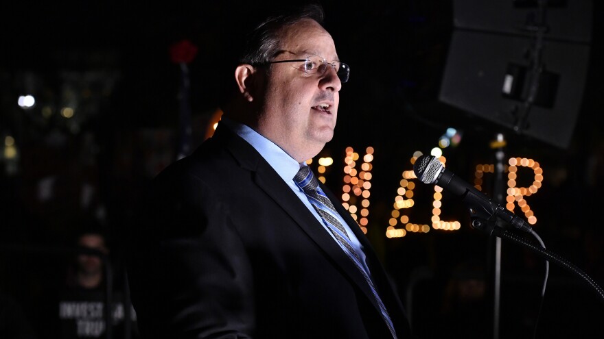 Walter Shaub, former head of the Office of Government Ethics, speaks at a 2018 rally protesting then-President Donald Trump's response to the Mueller investigation.