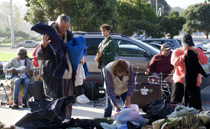 A 3-man band jammed for nearly 3 hours straight at an Al & Friends Sunday breakfast on October 26, 2025. People picked out clothes that were donated from Sudz Cyber Laundry in Pacific Grove. The musicians pictured in the background (from left to right) are Azi Fedoui, Sargis Atanous, and Andrew Atanous.