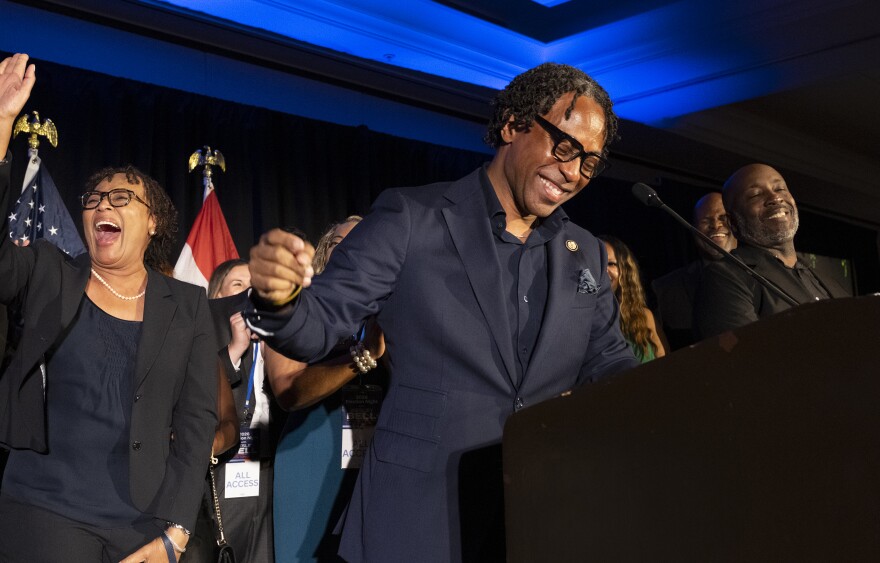 U.S. Rep. Wesley Bell, D-St. Louis County, laughs with supporters after defeating former U.S. Rep. Cori Bush in Missouri's Democratic primary during his election night watch party at the Marriott St. Louis Grand on Tuesday in downtown St. Louis.