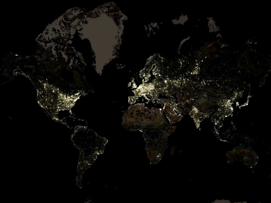 A nighttime satellite image offers some information about pockets of poverty — that's where electricity isn't lighting things up.