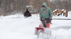 Chris Kane, front, uses a snowblower to clear snow from Lake Eston Wilson at Hillside Park in South Abington Twp. He and Ken Lee, in background, volunteer regularly to keep the lake open for ice skating.
