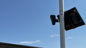 A Flock Safety camera captures vehicle data at 84 South in Greenfield.
