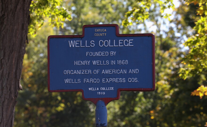 A historical marker stands outside the former Wells College campus in the village of Aurora, New York. Wells College was founded in 1868 by Henry Wells, co-founder of the American Express Co. and Wells Fargo. Established as a college for women, Wells remained a women’s college for more than 130 years before becoming coeducational in 2005. The college closed in 2024