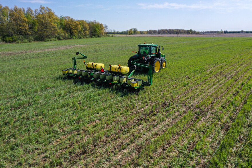 A farmer plants corn into a stand of cover crops. The Environmental Quality Incentive Program, first authorized by the 1996 Farm Bill, is NRCS’ flagship conservation program to help farmers, ranchers and forest managers integrate conservation into working lands.