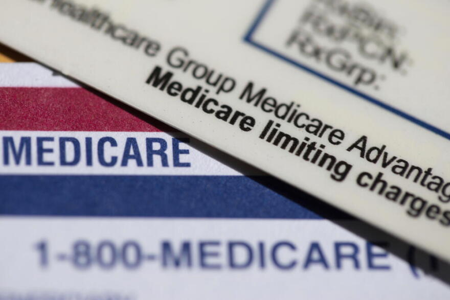 A Medicare Advantage PPO card rests on top of a Medicare card in Portland, Ore., June 10, 2024. (Jenny Kane/AP)