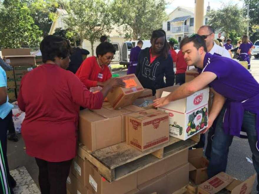 Volunteers preparing grocery bags for more than 500 Parramore residents to eat over the Thanksgiving holiday. Photo: Renata Sago, WMFE.