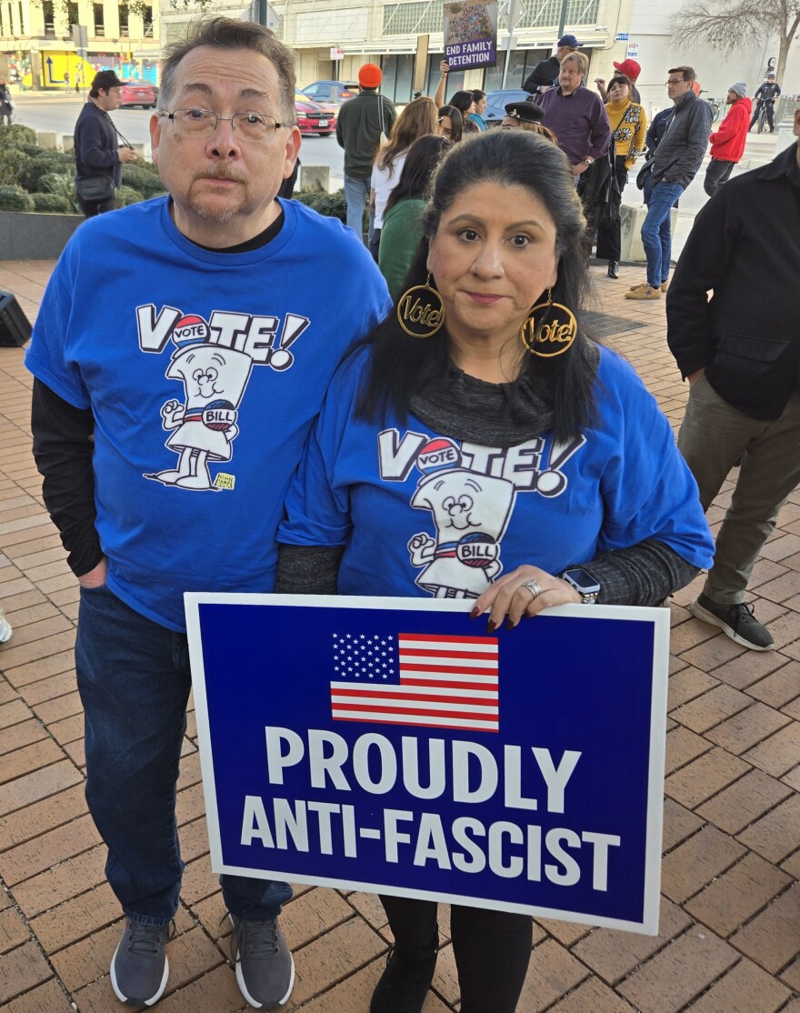 A couple of protestors held up this sign at city hall on Jan. 28, 2026