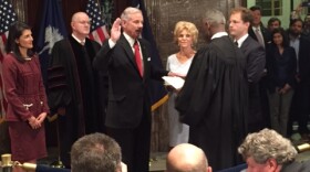 Lt. Governor Henry McMaster places his hand on the Bible as Chief Justice Don Beatty swears him in to be the 117th governor of South Carolina.