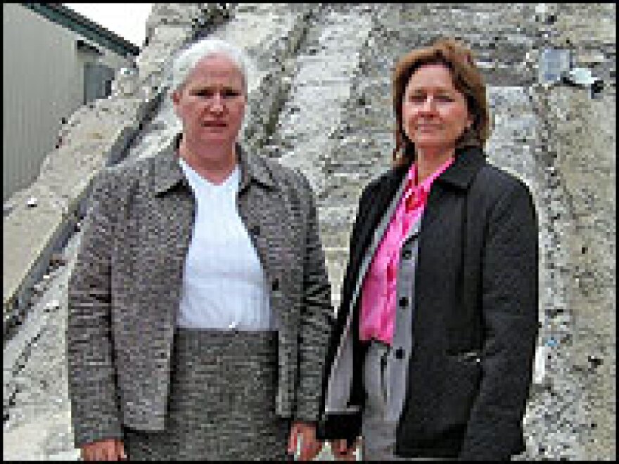 Patty Clark, left, and Kayla Bergeron stand on the Vesey Street, or "survivor" stairs. The two Port Authority workers were at the World Trade Center on Sept. 11, 2001, and escaped via the Vesey Street staircase 10 minutes before their tower collapsed.