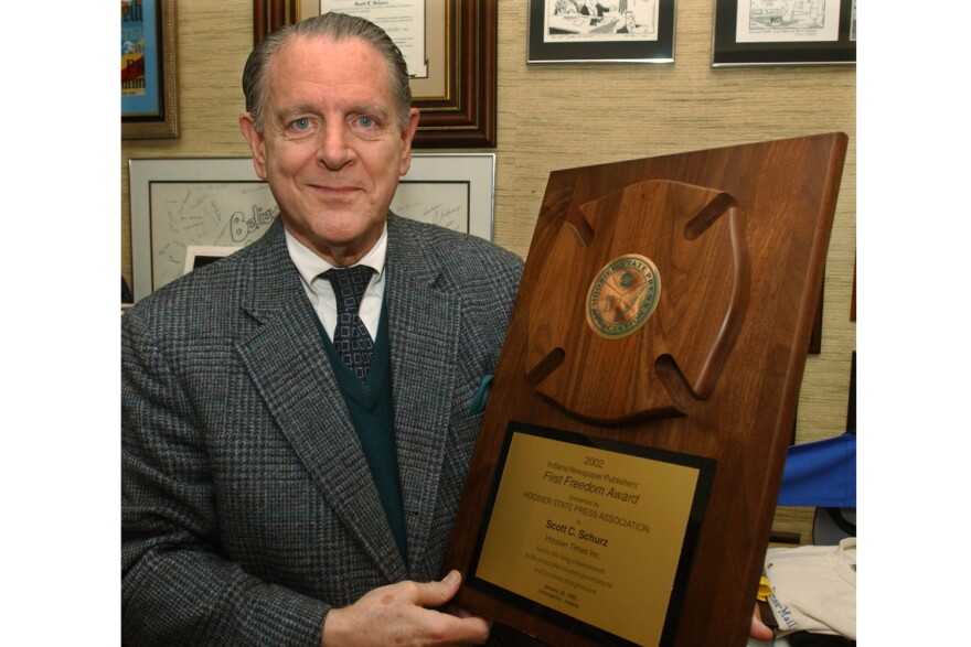 Former Herald-Times owner Scott Schurz holds his HSPA 2002 award, April 2003.