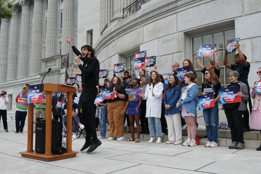 Alex Cook, with Abortion Action Missouri, leads supporters in chants during a rally on May 3, 2024 to celebrate the turning in of more than 380,000 signatures for a petition that would legalize abortion in Missouri.