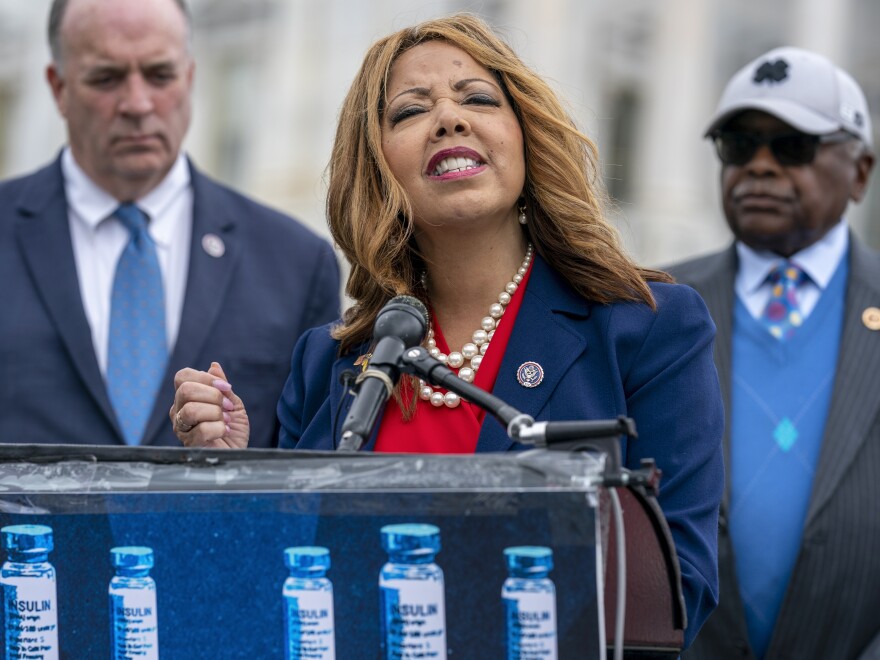 Rep. Lucy McBath, flanked by Rep. Dan Kildee and House Majority Whip James Clyburn, speaks to reporters about a bill to cap the price of insulin at the Capitol on March 31, 2022.