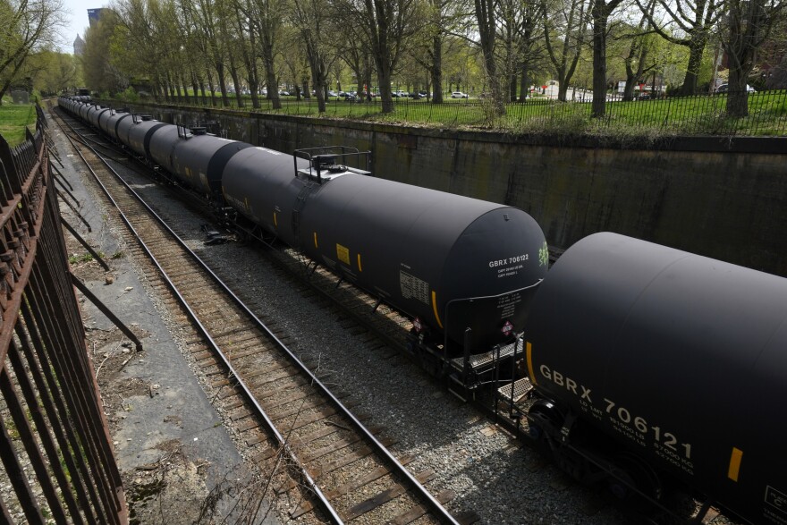 A Norfolk and Southern freight train rolls through the Northside of Pittsburgh on Saturday, April 10, 2021. (AP Photo/Gene J. Puskar)