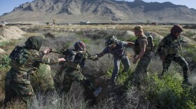 Ktah Khas Afghan Female Tactical Platoon members participate in morning physical training outside Kabul, Afghanistan.