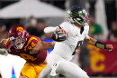 Oregon quarterback Dylan Raiola, right, passes while under pressure from Southern California defensive end Luke Wafle during the second half of an NCAA college football game, Saturday, Sept. 26, 2026, in Los Angeles. (AP Photo/Mark J. Terrill)