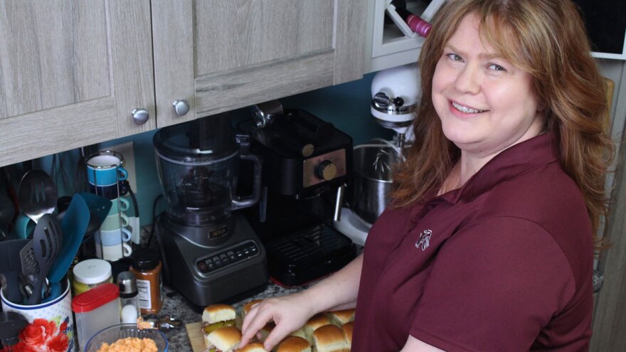 Niki Davis prepares porky pimento cheese sliders for tailgate grilling.