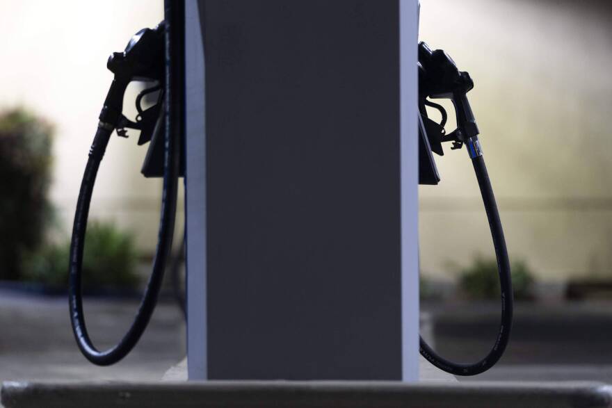 Gas nozzles are pictured at a Mobil gas station. (Jae C. Hong/AP)