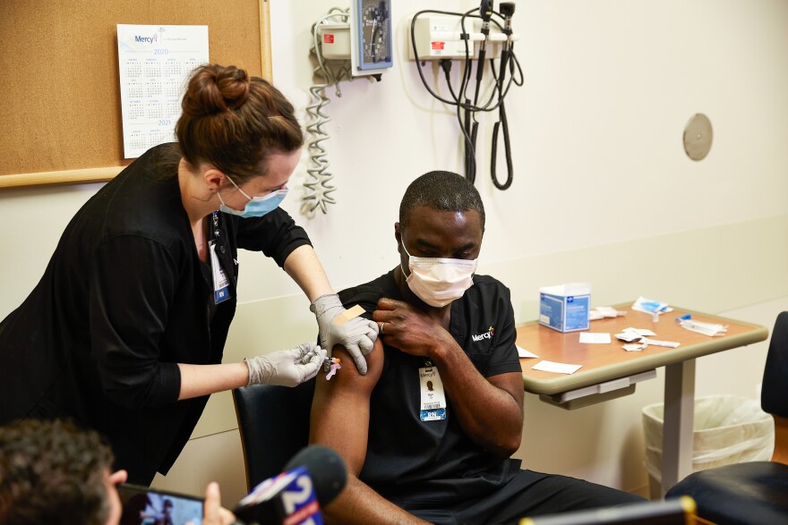 Nurse Ben Ojie was among the first in the St. Louis region to receive a coronavirus vaccination. Ojie works works in the COVID-19 unit at Mercy South Hospital in south St. Louis County. Monday, December 14, 2020.
