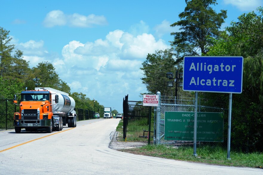 FILE - Trucks come and go from the "Alligator Alcatraz" immigration detention center in the Florida Everglades, Thursday, Aug. 28, 2025, in Collier County, Fla. (AP Photo/Rebecca Blackwell, File)