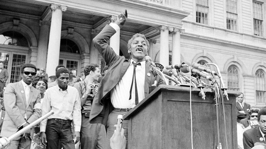 Bayard Rustin speaks in front of City Hall in New York on May 18, 1964, at a rally for school integration.