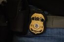 FILE - A federal agent wears an Immigration and Customs Enforcement badge in New York, June 10, 2025. (AP Photo/Yuki Iwamura, File)