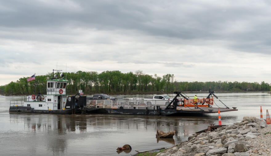 The Grafton Ferry docks on the Grafton side of the Mississippi and Illinois rivers with two pickups aboard on Friday morning.