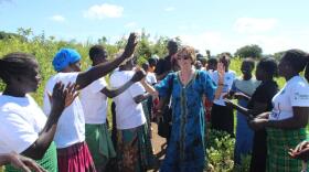 The Greater Contribution founder Karon Wright with some of the women her non-profit helped in Uganda.