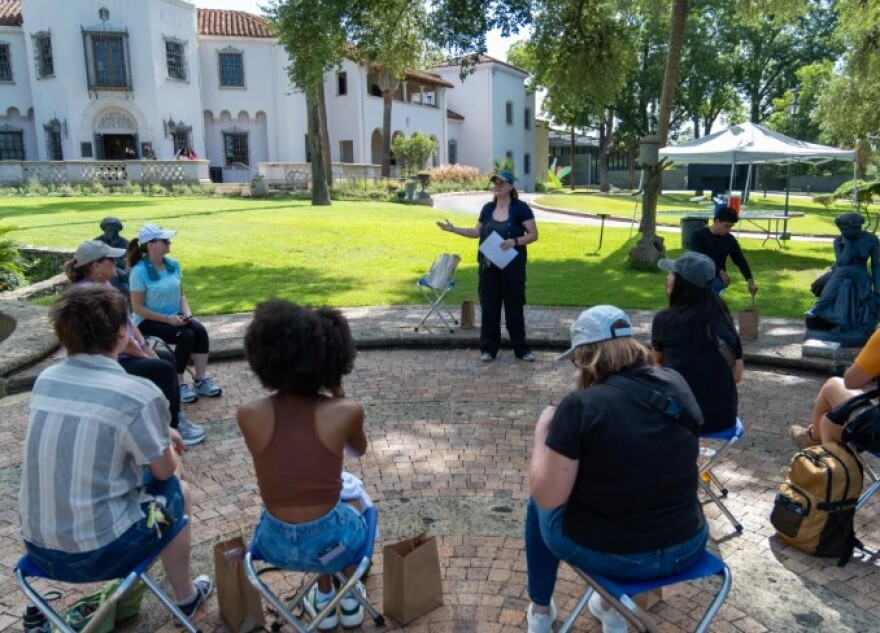 A gathering on the front lawn at the McNay