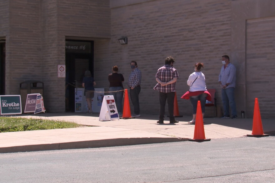 Voters line up to cast ballots at Edgewood High School on June 2th, 2020.