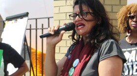 Rep.Rashida Tlaib speaking in front of a group of people