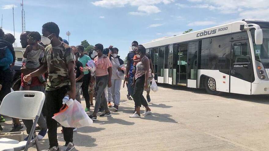 A first group of Haitian migrants arrives in Port-au-Prince, Sunday, September 19, 2021, after being deported by the Biden administration. They were among nearly 15,000 migrants, many of them Haitians, who flocked to the Del Rio, Texas, border hoping to get into the United States. Haiti has been told thousands more will be returned in the coming days.