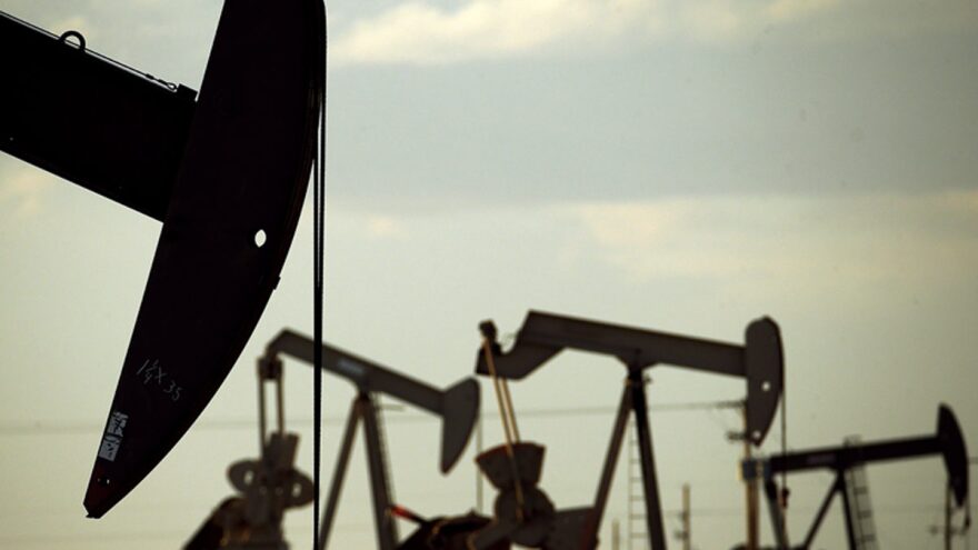 Pumpjacks work in a New Mexico field.