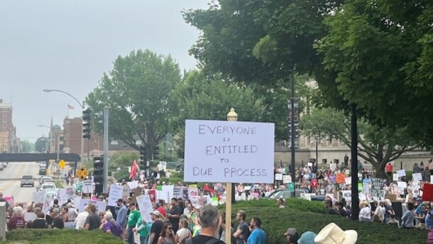 A crowd gathered in front of the Illinois statehouse at a protest in June 2025.