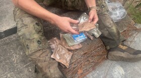 A Special Operations solider at Fort Bragg, N.C. digs into a Close Combat Assault Ration, the military's newly introduced meal for troops in the field.
